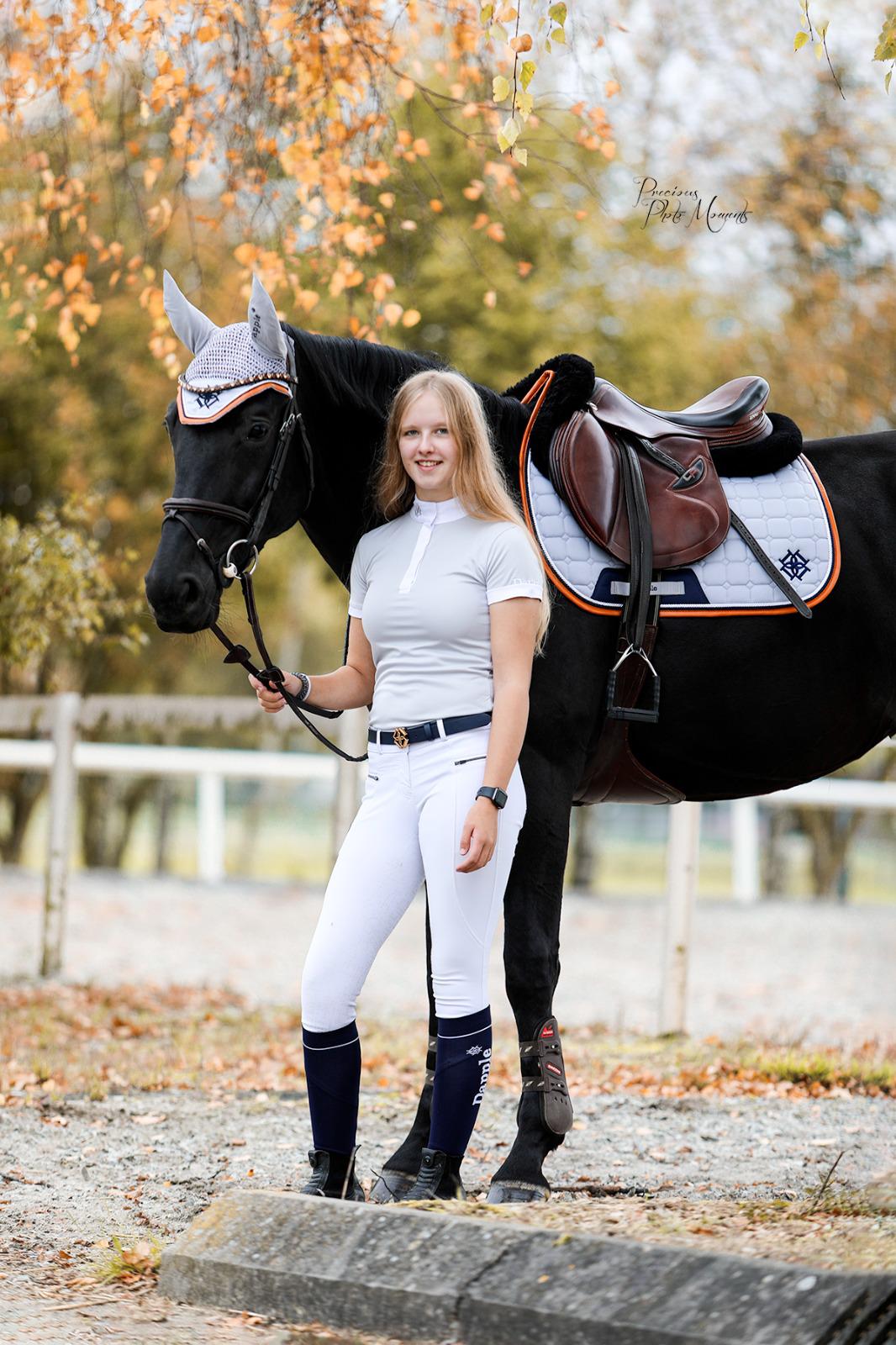 Horse and rider wearing matching set. Ear Bonnet, Saddle Pad and Show Shirt