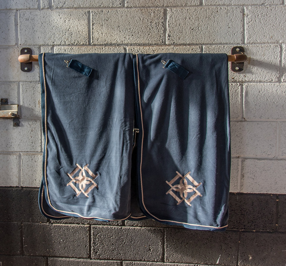 Dapple Equestrian Horse Rugs hanging in stable