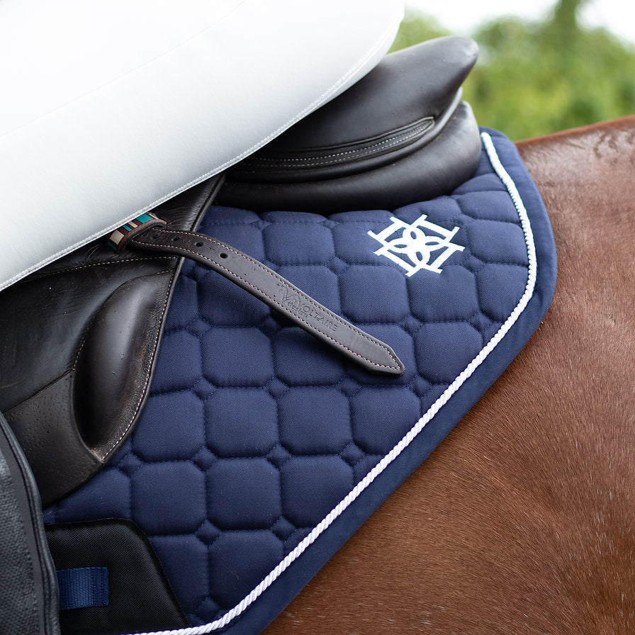 Close up of Dapple Equestrian's Navy Cutaway saddle pad