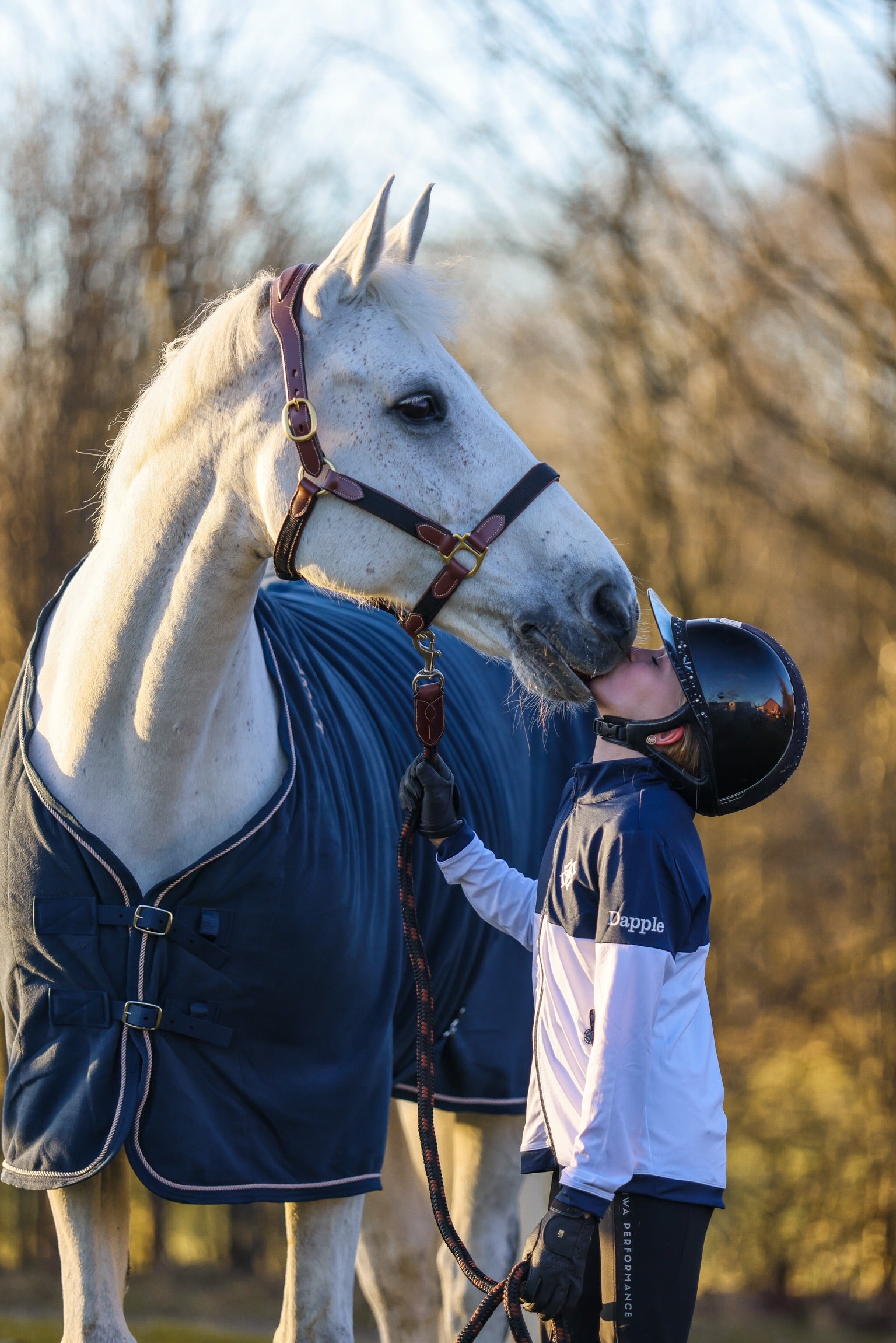 Young horse rider with white pony wearing Dapple Head Collar and Lead Rope