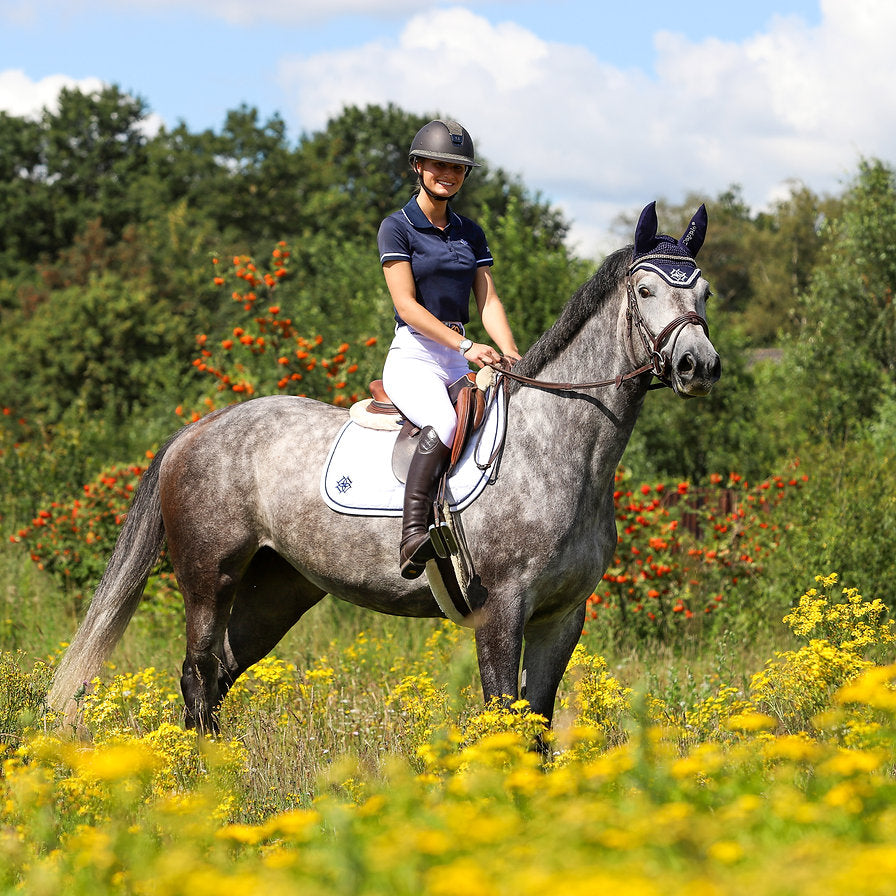 Equestrian Bibi Van Gehlen - wearing Dapple Equestrian with a Dapple Grey Horse wearing a White Jump Saddle Pad